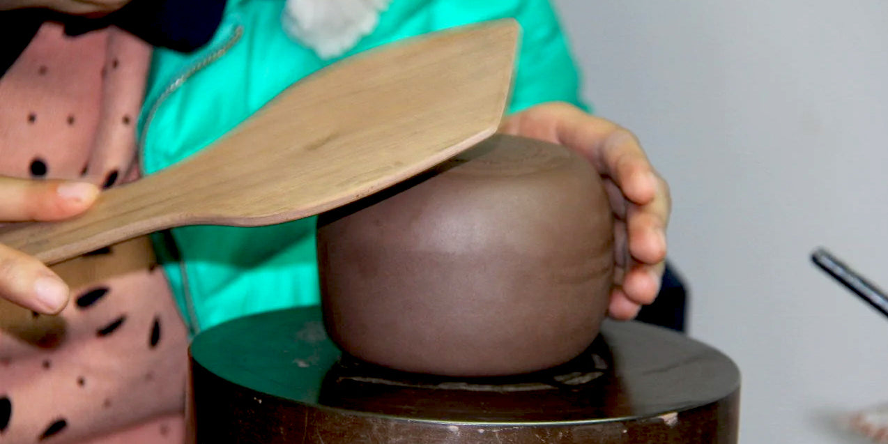 Mr Ge's daughter making a fully handmade Yixing teapot in their studio. #familybusiness