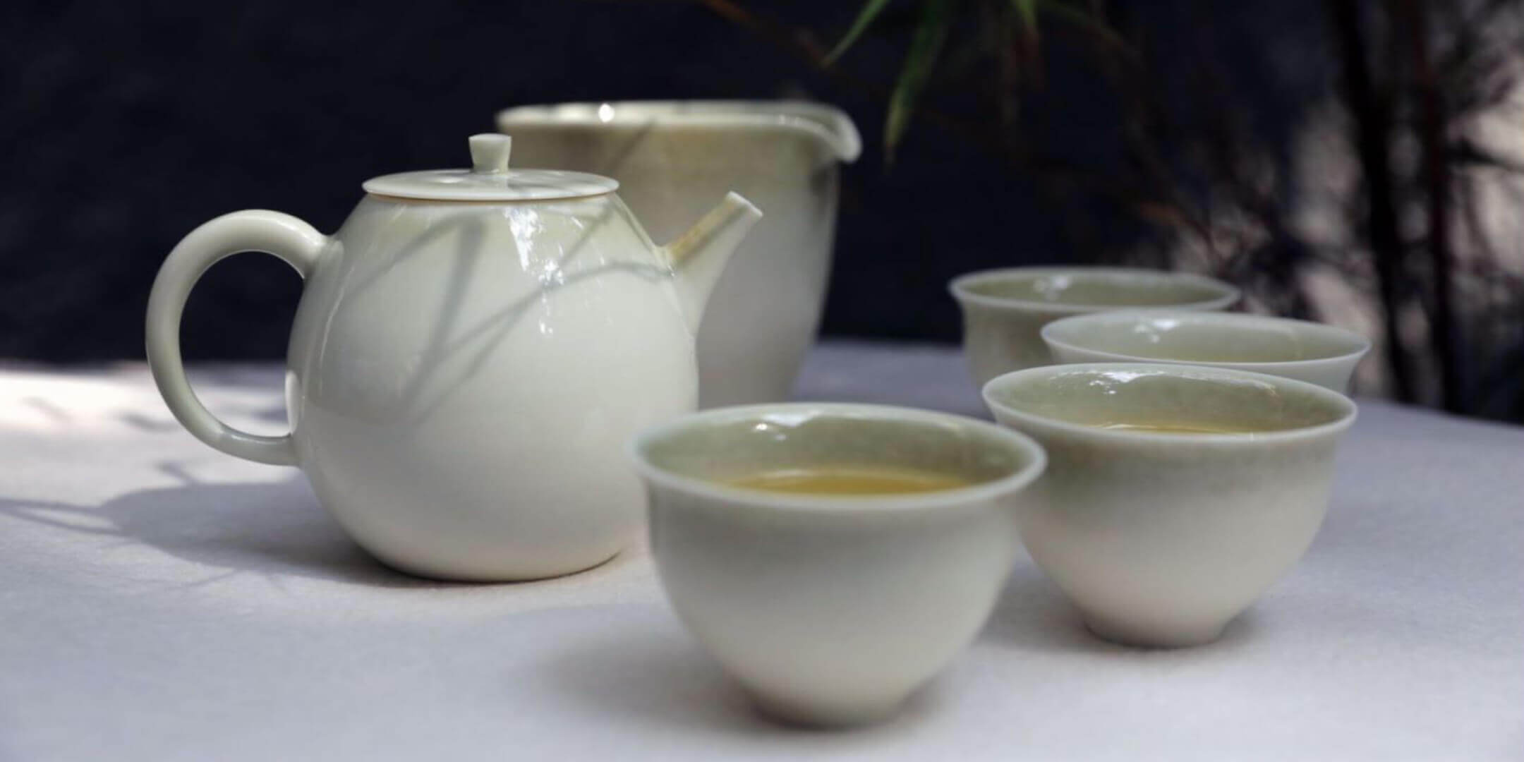 Chinese Tea Set. Dehua gongfu teapot teaset. Teapot and gongfu tea cups with a gongfu 'fair for everyone' jug.