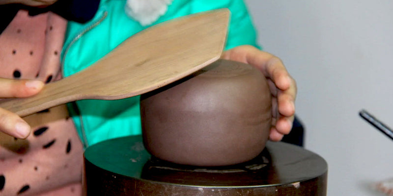 Mr Ge's daughter making a fully handmade Yixing teapot in their studio. #familybusiness