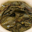 Yeyun Laocong Tieguanyin Oolong Tea being prepared in a white, Dehua gaiwan.  Abandoned tea garden Old Bush Tie Guan Yin tea from Anxi, Fujian.