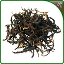 Yunnan Sun-Dried Black Tea leaf on a white background.