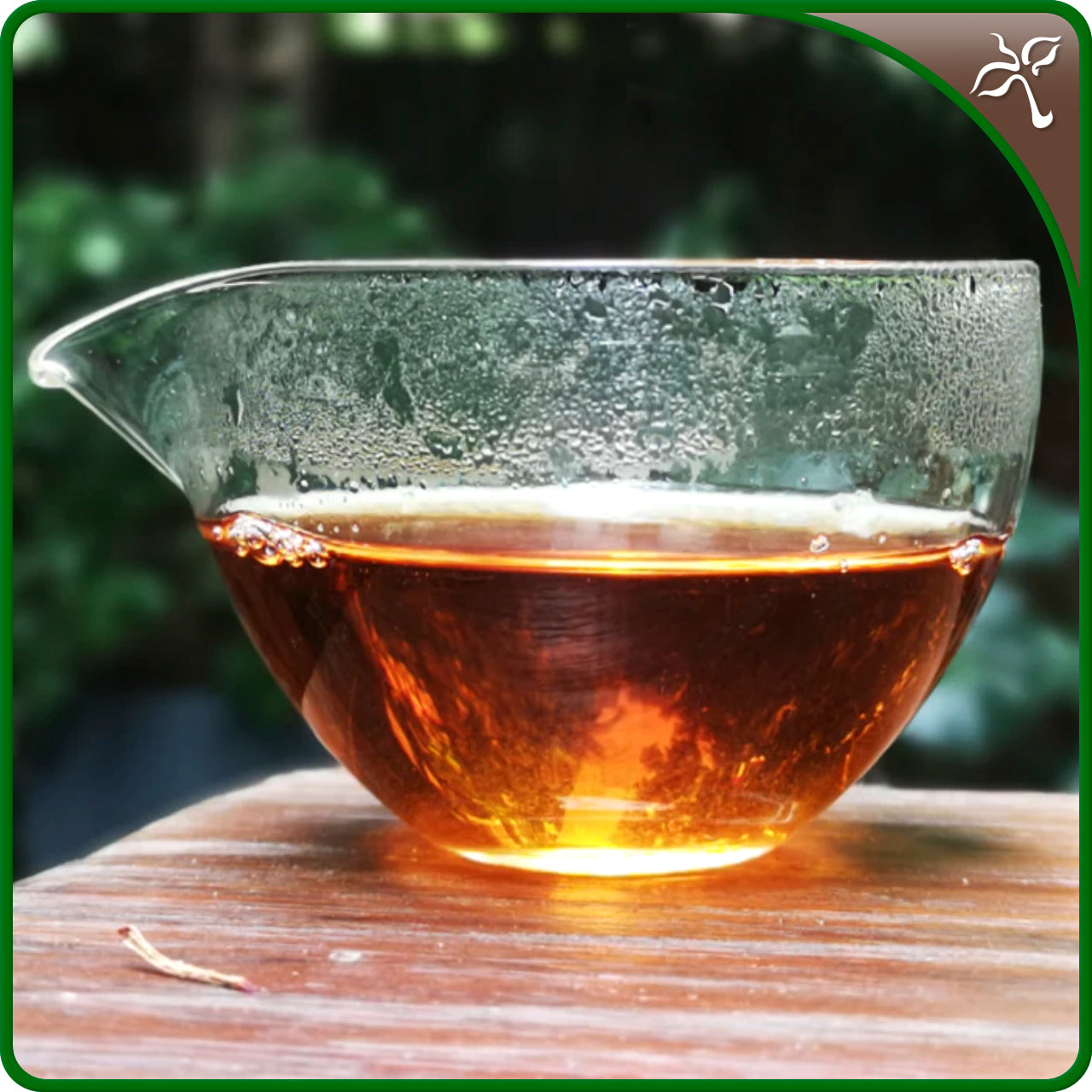 Yunnan Sun-Dried Black Tea liquor in a glass gong-dao-bei (fair for everyone jug).