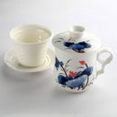 Lotus design tea mug set. Lidded tea mug with filter and saucer.