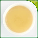 Jasmine tea liquor in Chinese white poreclain tea cup.