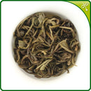 Brewed jasmine tea pearls in a gaiwan. The jasmine green tea pearls open up to show the fine tea leaves.